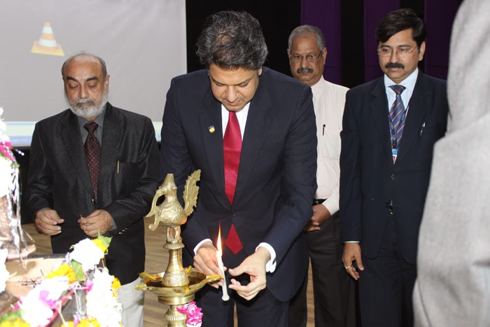 Dr. Aseem Chauhan lighting the lamp at Amity University Gwalior