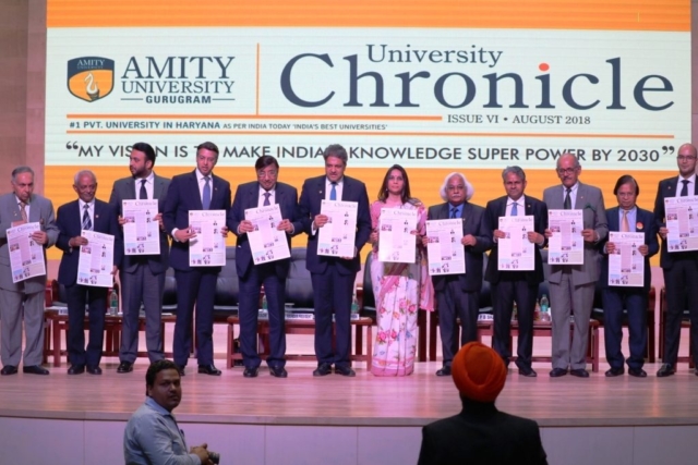 Dr. Aseem Chauhan with Founder President Dr. Ashok Chauhan and other Eminent Amity Dignitaries showcasing University Chronicles at Amity University Gurugram 2018